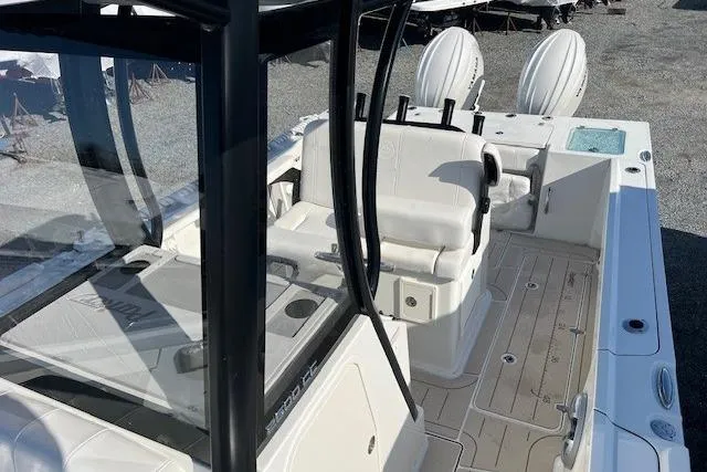 Slide: The Image of 2025 Parker 2600 Center Console boat with dual engines and spacious deck. - 23