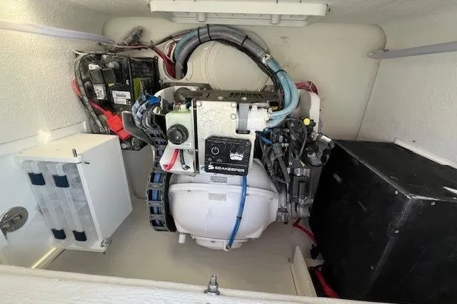 Slide: The Image of Engine compartment of 2025 Parker 2600 Center Console boat, featuring Seakeeper stabilizer. - 29