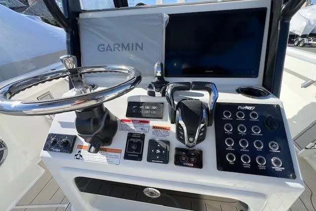 Slide: The Image of 2025 Parker 2600 Center Console boat dashboard with Garmin navigation and control panel. - 30