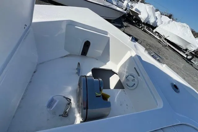Slide: The Image of 2025 Parker 2600 Center Console boat deck with anchor storage and winch system. - 32