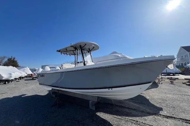 Slide: The Image of 2025 Parker 2600 Center Console boat on display in a sunny outdoor setting. - 35