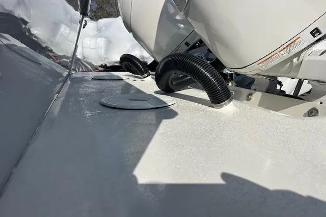 Slide: The Image of 2025 Parker 2600 Center Console boat deck with engine and ventilation hose. - 38