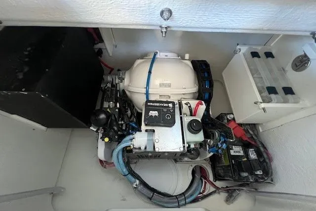 Slide: The Image of Engine compartment of a 2025 Parker 2600 Center Console boat, showcasing mechanical components. - 42