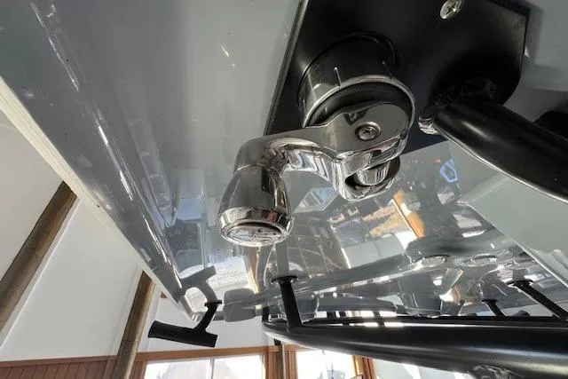Slide: The Image of Close-up of a 2025 Parker 2600 Center Console boat's chrome faucet and fixtures. - 9