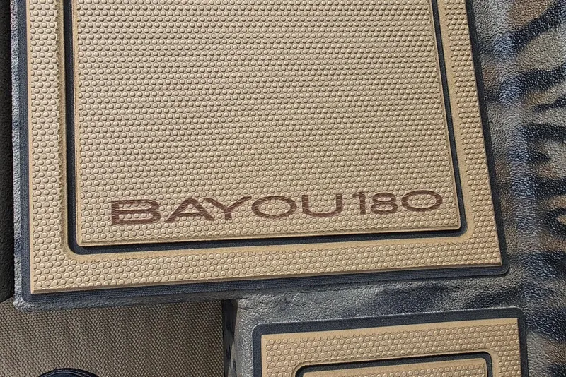Slide: The Image of Xpress Bayou 180 boat floor mat with textured design, 2026 model. - 13