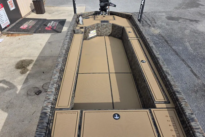 Slide: The Image of 2026 Xpress Bayou 180 boat interior with camouflage design and spacious deck layout. - 15