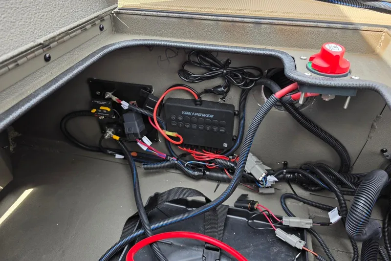 Slide: The Image of Electrical wiring setup in a 2026 Xpress Bayou 180 boat compartment. - 22