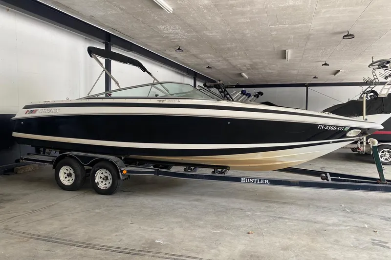 The Image of 1999 Cobalt 252 boat on trailer in indoor storage facility. - 1