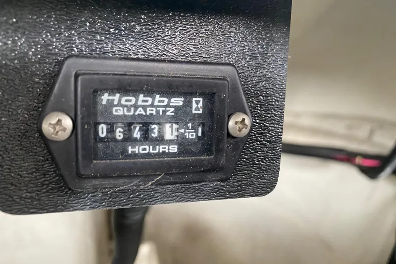 Slide: The Image of Hobbs Quartz hour meter showing 643.1 hours on a 1999 Cobalt 252 boat. - 13