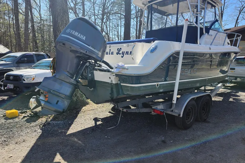 Slide: The Image of 2015 Robalo R245 Walkaround boat on trailer with Yamaha outboard motor. - 3