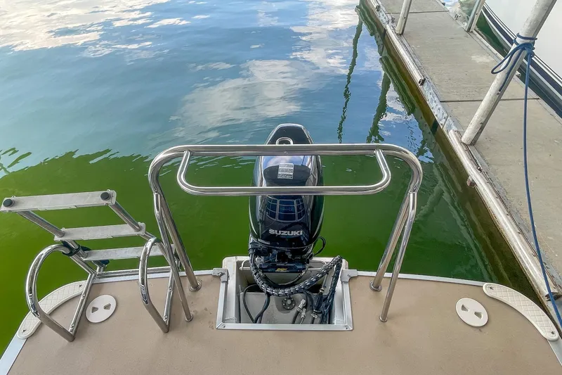 Slide: The Image of Rear view of a 2011 Berkshire 263 SLX boat with Suzuki outboard motor. - 16