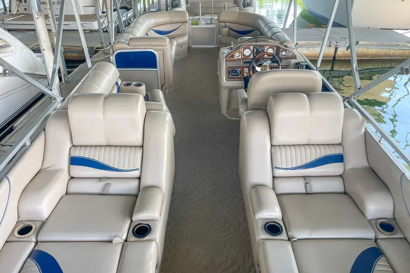 Slide: The Image of Luxurious interior of a 2011 Berkshire 263 SLX pontoon boat with plush seating. - 18
