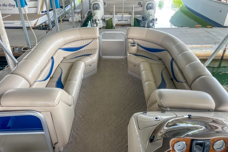 Slide: The Image of Luxurious interior of a 2011 Berkshire 263 SLX pontoon boat with plush seating. - 22