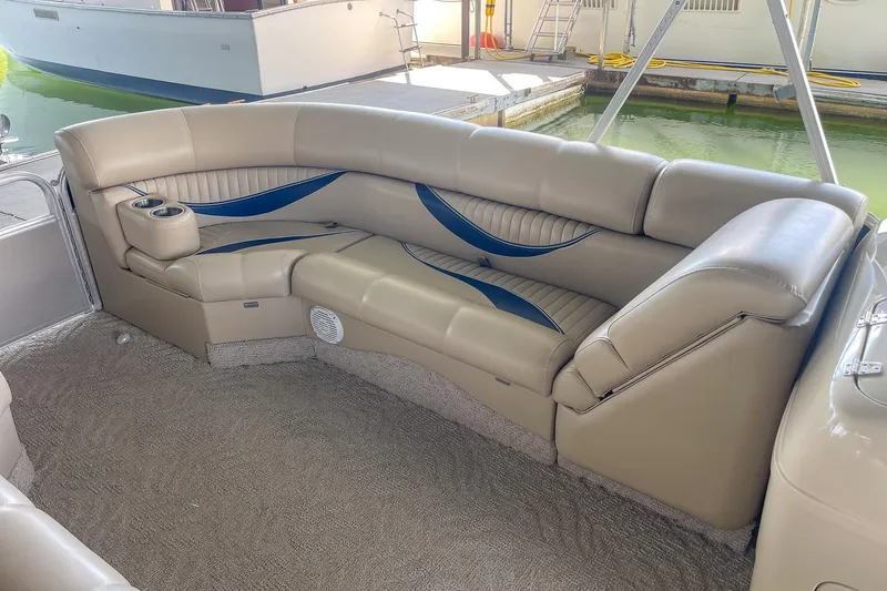 Slide: The Image of Luxurious seating on a 2011 Berkshire 263 SLX boat with beige and blue accents. - 23
