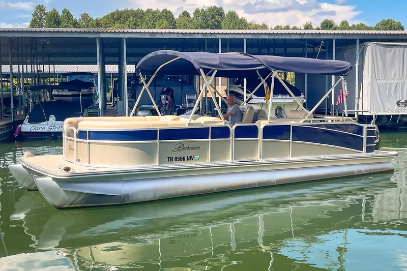 Slide: The Image of 2011 Berkshire 263 SLX pontoon boat docked in a marina with canopy. - 4