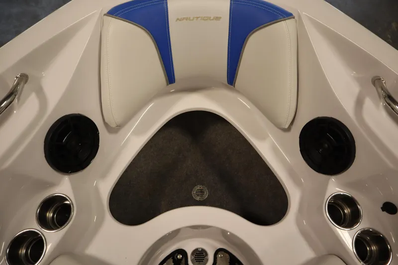 Slide: The Image of 2011 Nautique 210 SUPER AIR boat interior with speakers and cup holders. - 12