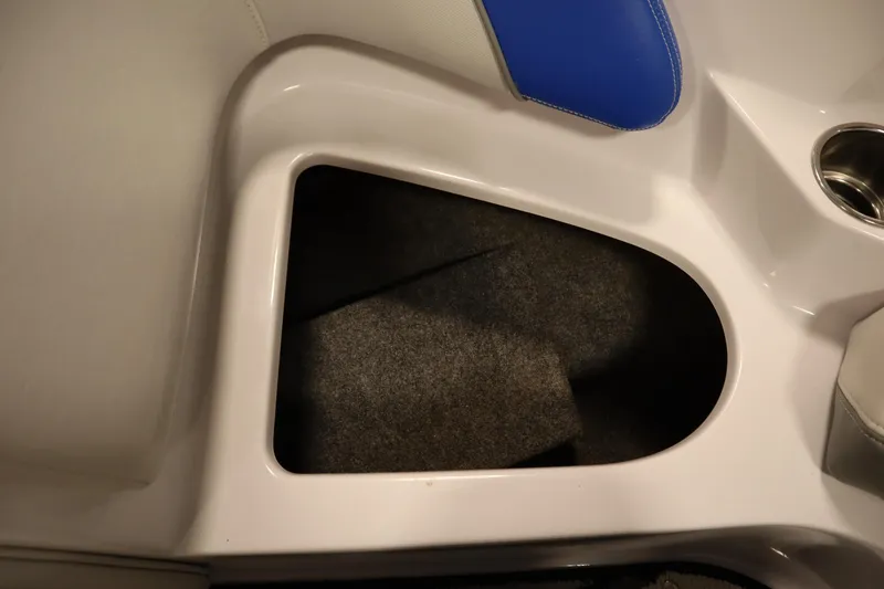 Slide: The Image of Storage compartment in 2011 Nautique 210 SUPER AIR boat with blue seat detail. - 14