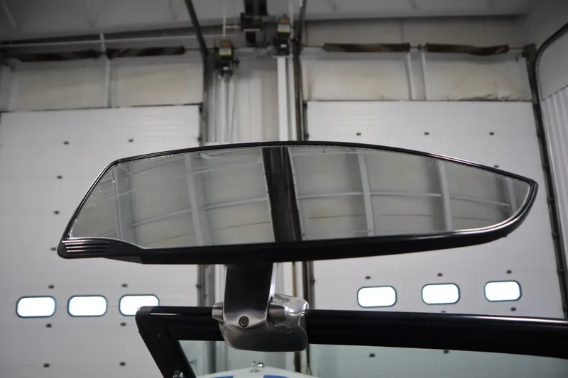 Slide: The Image of 2011 Nautique 210 SUPER AIR boat mirror in a garage setting. - 21