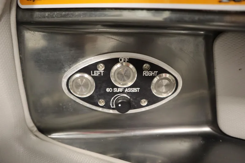 Slide: The Image of Control panel of 2011 Nautique 210 SUPER AIR with surf assist buttons. - 24