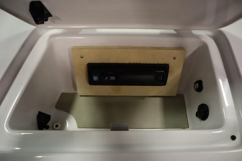 Slide: The Image of 2011 Nautique 210 SUPER AIR boat stereo compartment with Alpine audio system. - 31