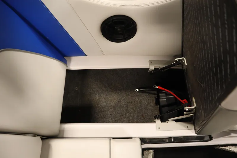 Slide: The Image of 2011 Nautique 210 SUPER AIR boat interior with battery compartment and seating. - 36