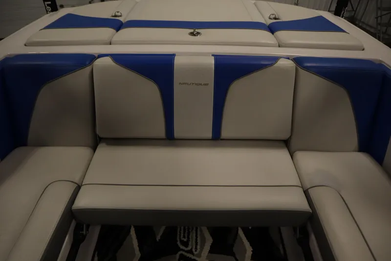 Slide: The Image of 2011 Nautique 210 SUPER AIR boat interior with blue and gray seating. - 38