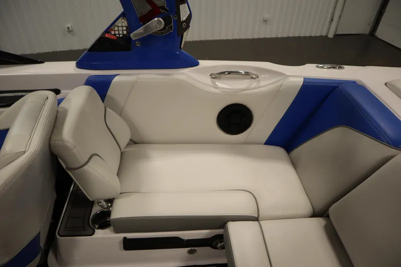 Slide: The Image of 2011 Nautique 210 SUPER AIR boat interior with blue and white seating. - 39