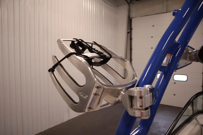 Slide: The Image of 2011 Nautique 210 SUPER AIR wakeboard rack on blue tower in garage. - 43