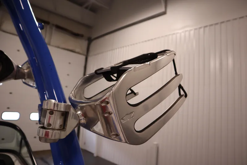 Slide: The Image of 2011 Nautique 210 SUPER AIR wakeboard rack, silver and blue, in a garage setting. - 44