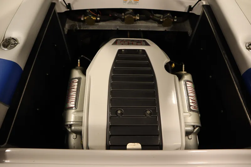Slide: The Image of 2011 Nautique 210 SUPER AIR engine compartment, showcasing powerful marine engine components. - 48