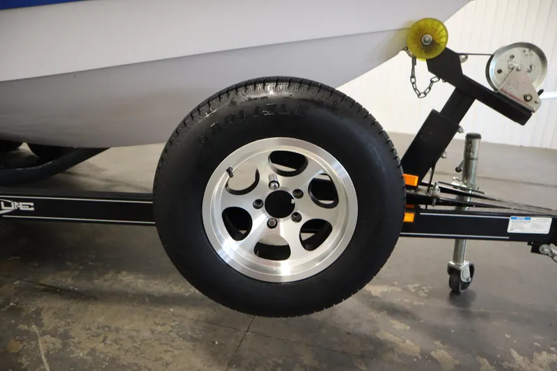Slide: The Image of Trailer wheel of 2011 Nautique 210 SUPER AIR boat on display. - 54