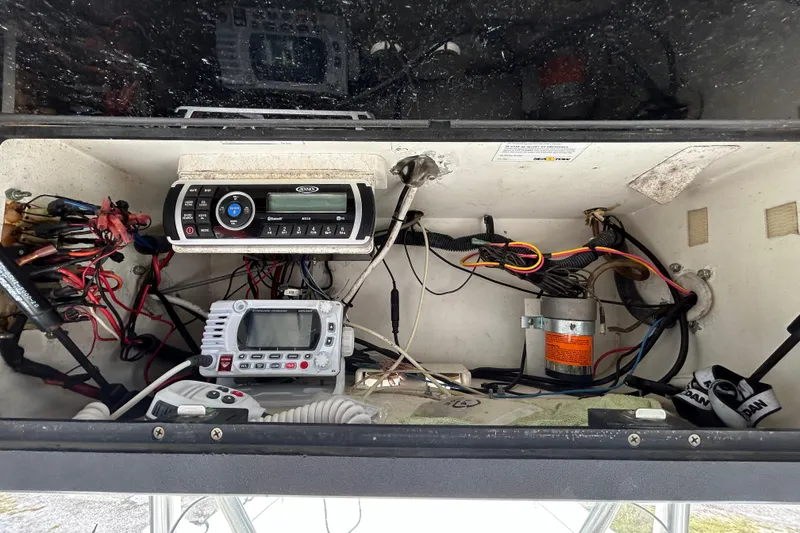 Slide: The Image of Electrical panel of a 2007 Triton 2486cc boat with wiring and control systems. - 13