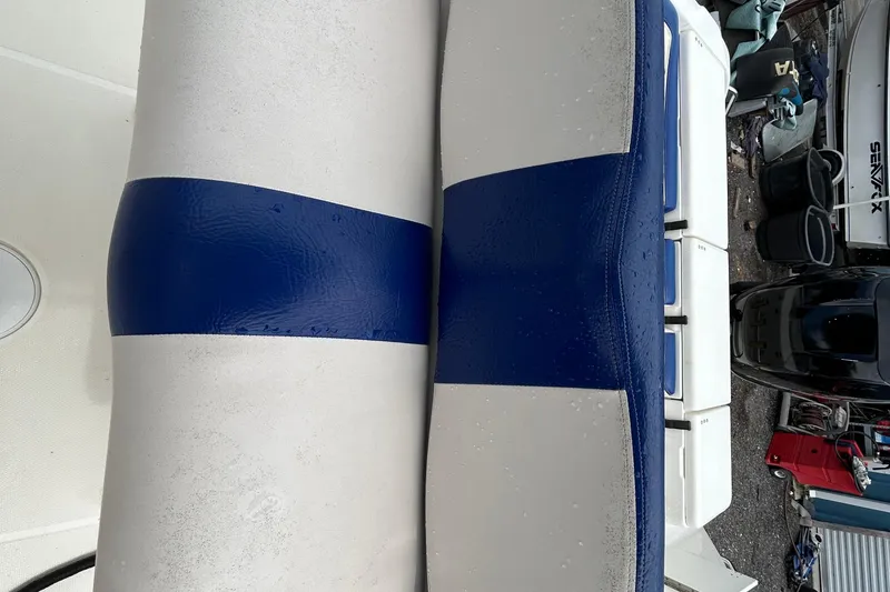Slide: The Image of Blue and white boat seat on a 2007 Triton 2486cc. - 14