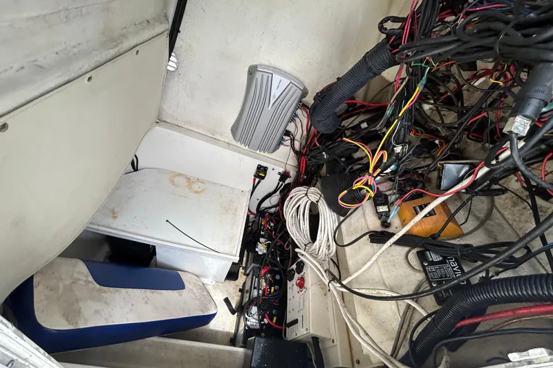 Slide: The Image of 2007 Triton 2486cc boat interior with wiring and equipment. - 17