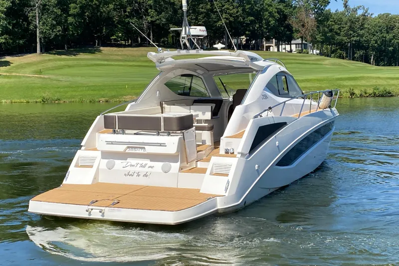 Slide: The Image of 2018 Galeon 385 HTS yacht interior with sleek wood flooring and modern seating. - 10