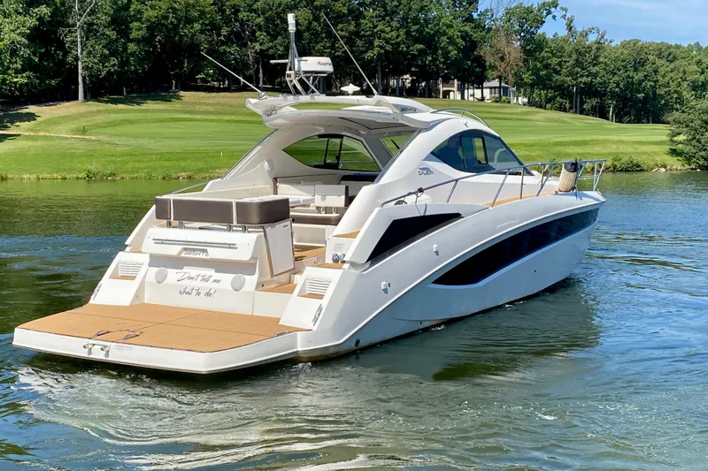 Slide: The Image of 2018 Galeon 385 HTS yacht, close-up of model name on white hull. - 11