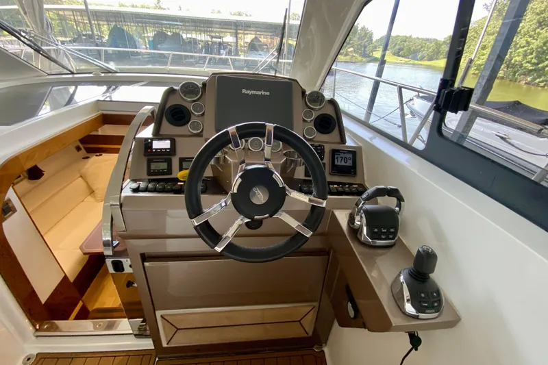 Slide: The Image of Interior view of 2018 Galeon 385 HTS yacht cockpit with modern controls and seating. - 34