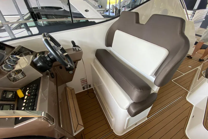 Slide: The Image of Interior of 2018 Galeon 385 HTS yacht with seating and table, featuring modern design. - 35