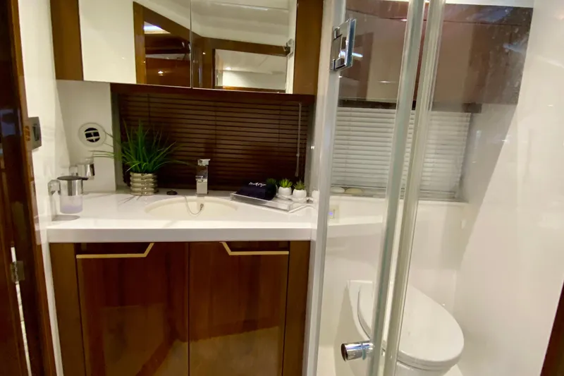 Slide: The Image of Control panel of 2018 Galeon 385 HTS yacht, illuminated with various switches and indicators. - 54