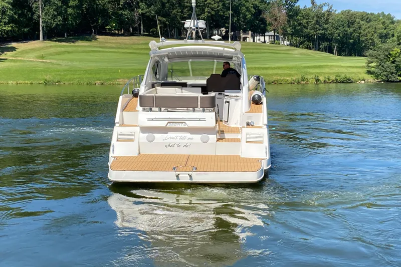 Slide: The Image of 2018 Galeon 385 HTS yacht docked, featuring sleek design and spacious deck. - 8