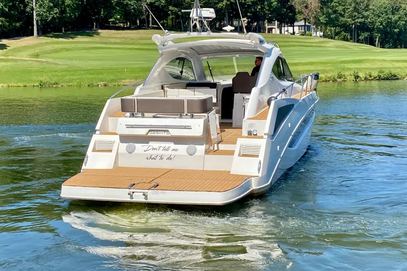 Slide: The Image of 2018 Galeon 385 HTS yacht steps with teak decking in a marina setting. - 9