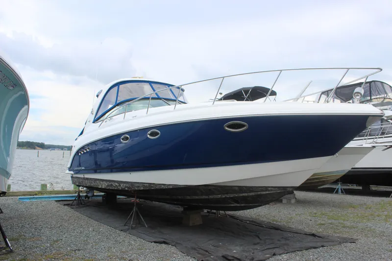 The Image of 2008 Chaparral Signature 350 boat on dry dock by the water. - 1