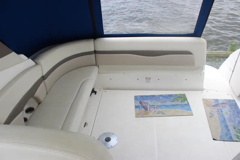 Slide: The Image of 2008 Chaparral Signature 350 boat interior with cushioned seating and decorative mats. - 20