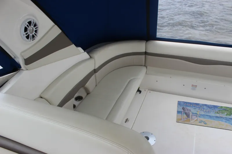 Slide: The Image of 2008 Chaparral Signature 350 boat interior with white seating and blue canopy. - 21