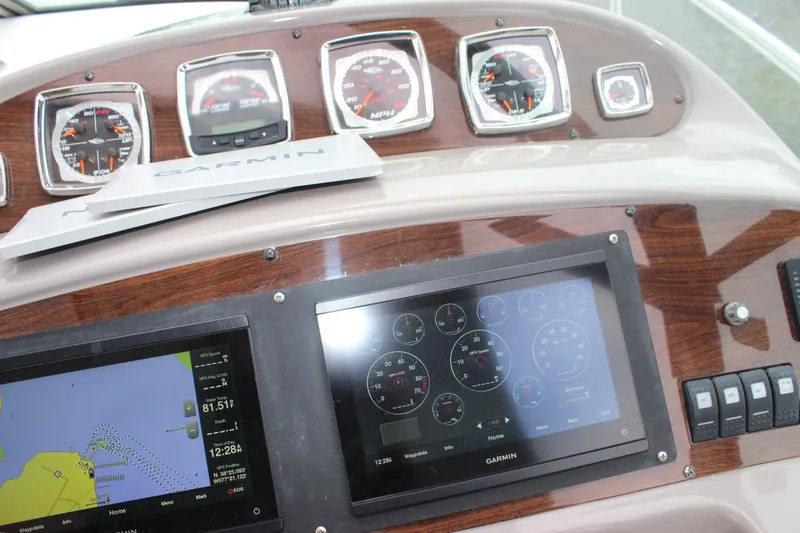 Slide: The Image of Dashboard of 2008 Chaparral Signature 350 with Garmin navigation and instrument panels. - 27