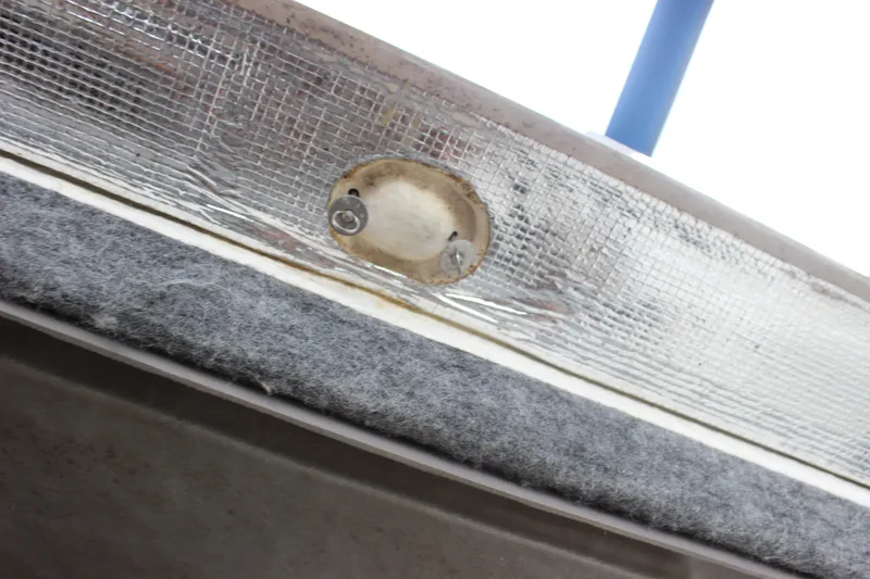 Slide: The Image of Close-up of 2008 Chaparral Signature 350 boat detail with textured surface and metal fixture. - 34