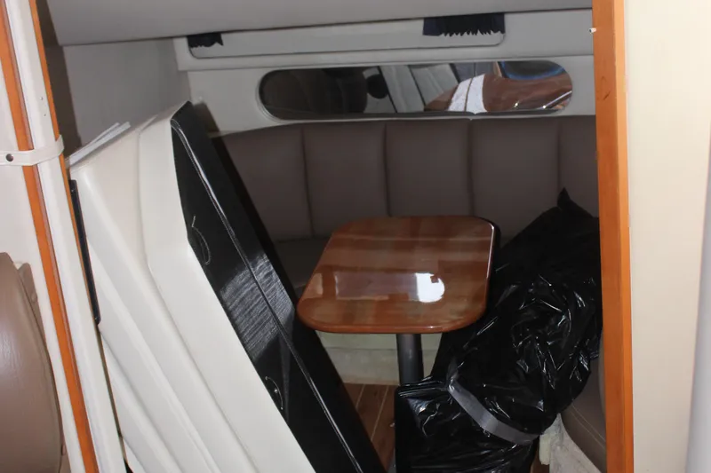 Slide: The Image of 2008 Chaparral Signature 350 interior with dining area and wooden table. - 38