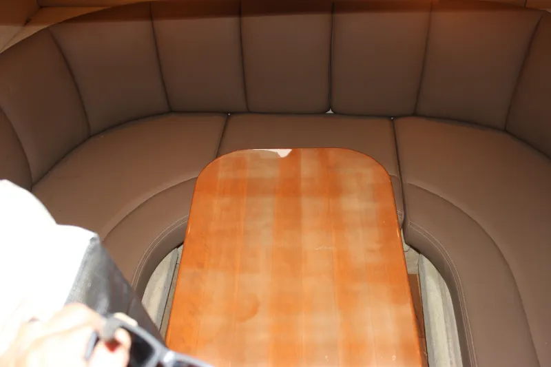 Slide: The Image of 2008 Chaparral Signature 350 interior with brown leather seating and wooden table. - 41