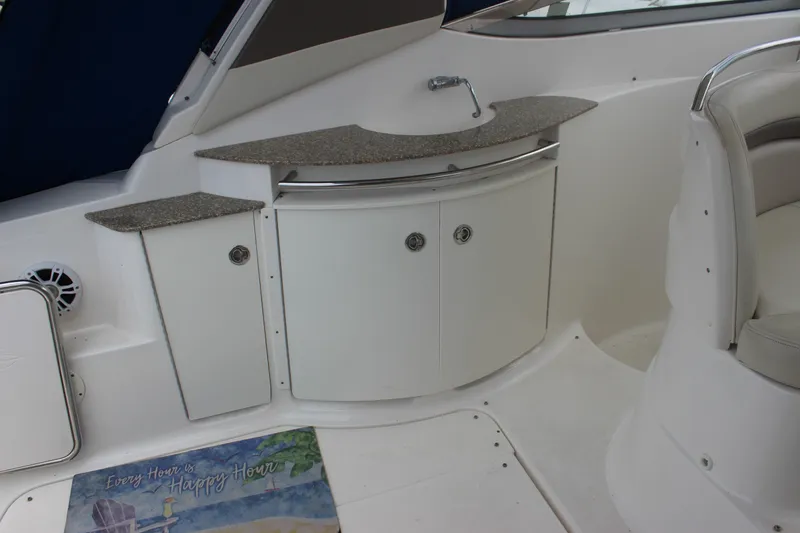 Slide: The Image of 2008 Chaparral Signature 350 boat interior with kitchenette and seating area. - 47