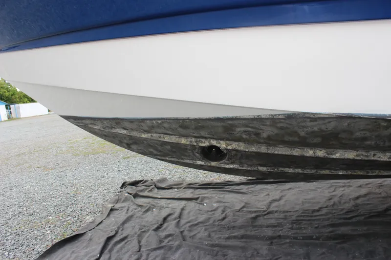 Slide: The Image of 2008 Chaparral Signature 350 boat hull on gravel, showing underside details. - 6